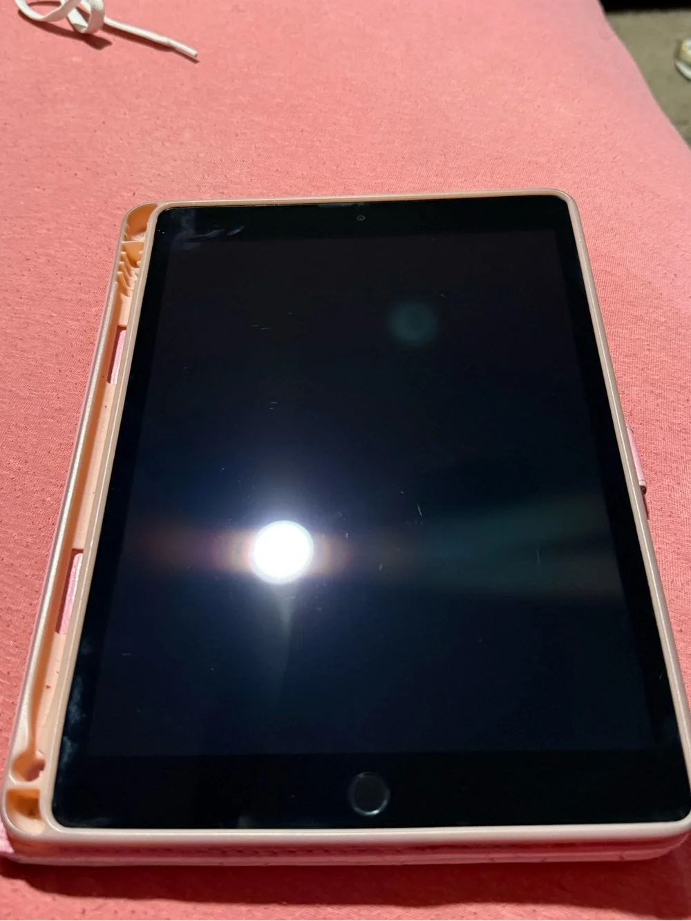 Apple iPad Tablet in Black with Blue Screen